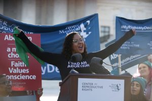 We Testify Executive Director Renee Bracey Sherman hypes up the crowd as the rally emcee at the oral arguments for the June Medical Services v. Russo case at the U.S. Supreme Court, March 4, 2020. Photo credit: Center for Reproductive Rights.