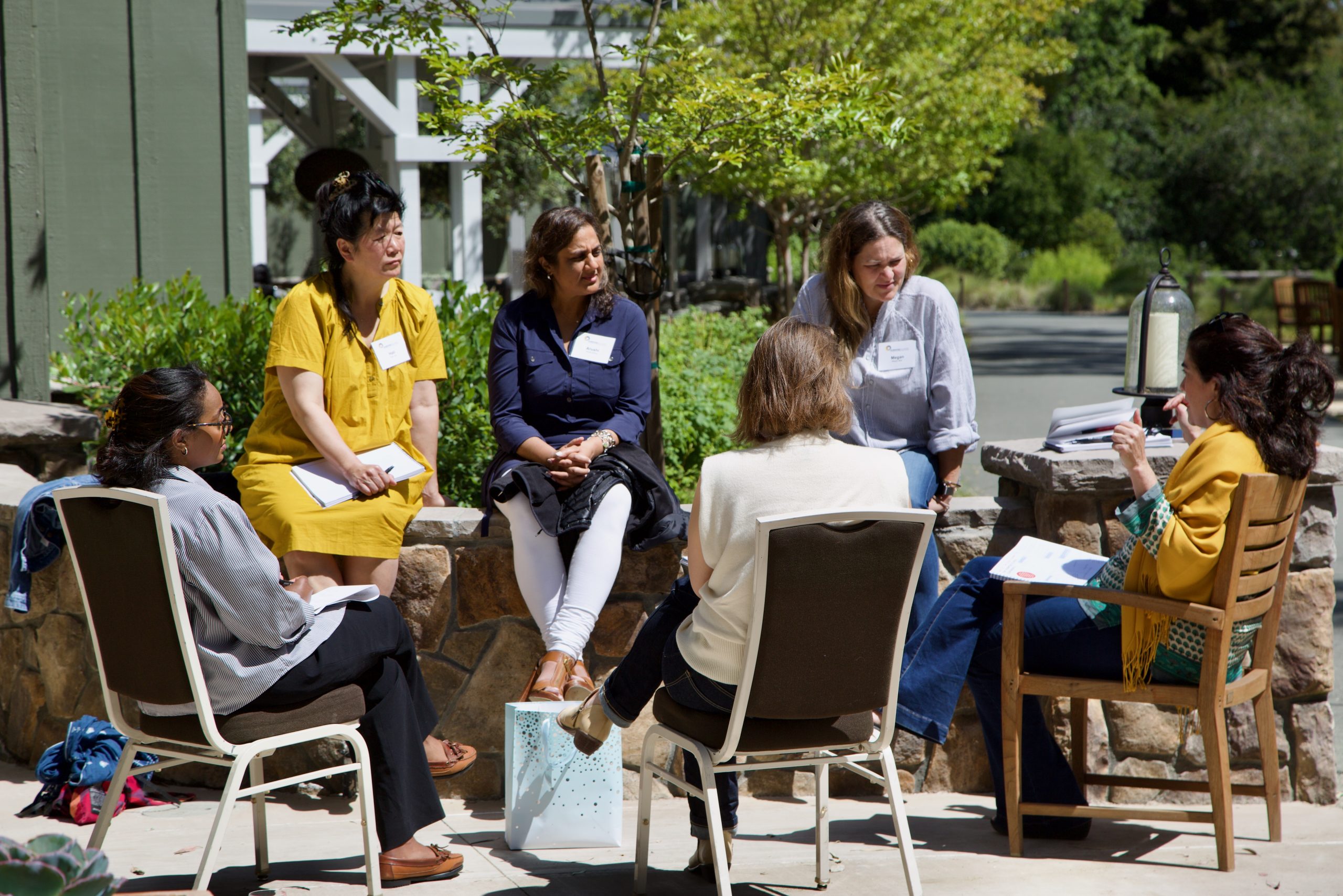 Picture of Raikes staff talking with partners.  credit: Raikes Foundation