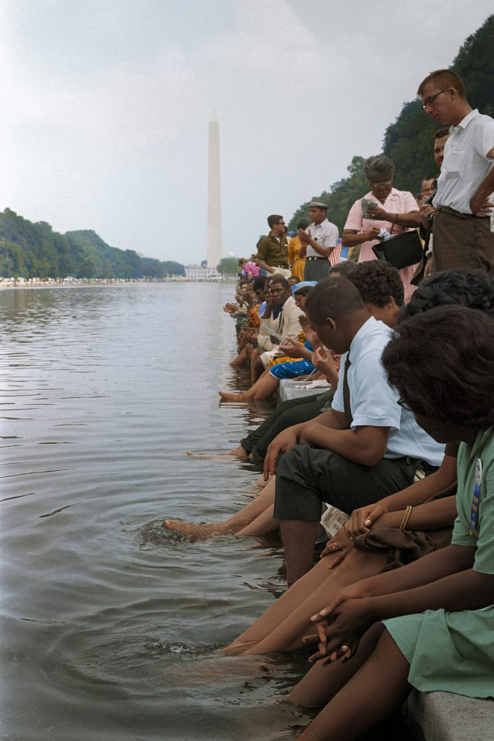 Demonstrators sit, with their feet in the Reflecting Pool, during the March on Washington, 1963]